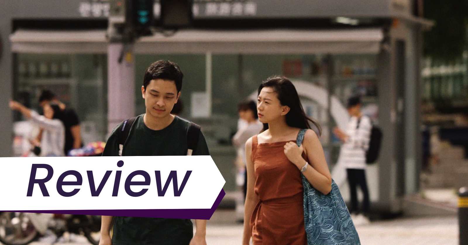 A man in a black tshirt and backpack and a woman in an ochre dress walk around Seoul together in Mimang directed by Kim Taeyang.