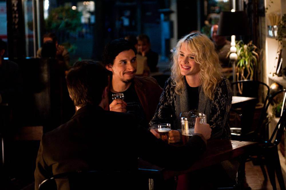 Adam Driver and Mackenzie Davis play romantic partners out at dinner in this still from the film.
