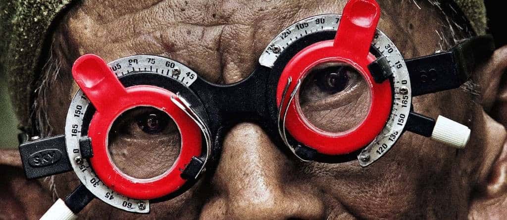 A man gets his eyes checked in The Look of Silence.