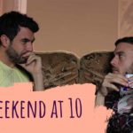A still from Weekend, of two men sitting on an old sofa together. The text on the image reads, 'Weekend at 10'.
