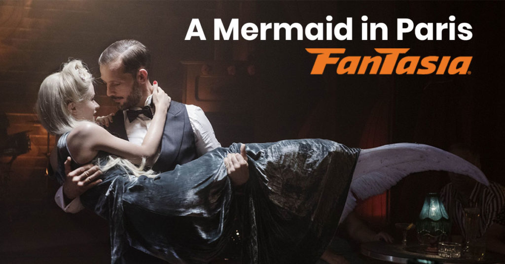 A man holds a mermaid in the still from the French film A Mermaid in Paris, currently playing at the Fantasia Film Festival.