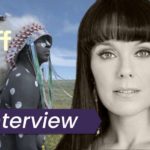 An Indigenous man in a traditional headdress surveys the landscape in Inconvenient Indian. In the foreground of the image is director Michelle Latimer. The text on the images reads 'Interview'.