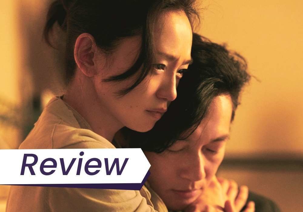 A couple embraces in Naomi Kawase's True Mothers.