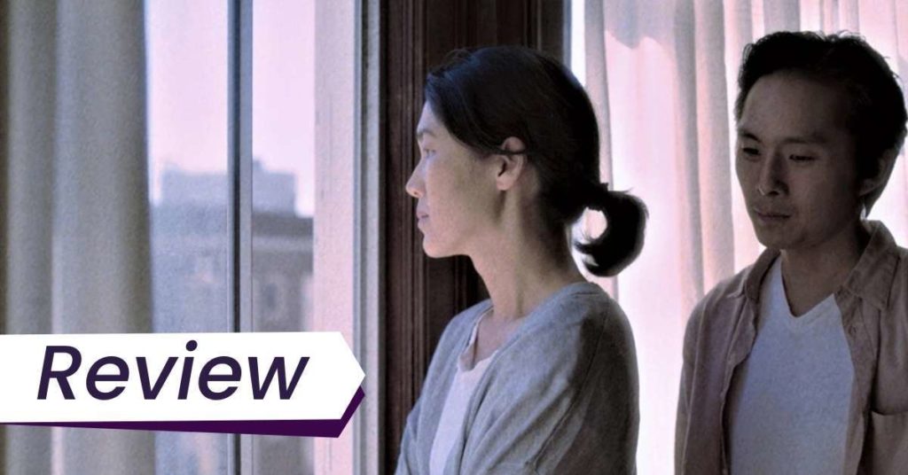 Still from Wayne Wang's Coming Home Again in which Chang-rae approaches his despondent mother as she stares out the window of their San Francisco house.