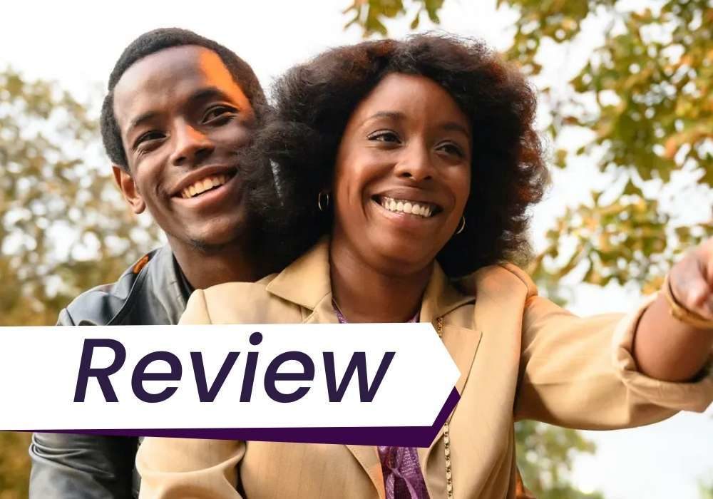 A man and a woman smile together in Lovers Rock. The word 'Review' is on the image.