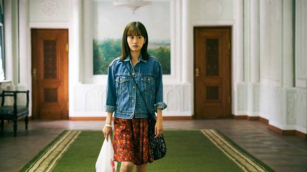Atsuko Maeda walks hesitantly down a museum corridor in To the Ends of the Earth.