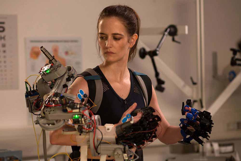 Eva Green operates mechanical machinery attached to her arms in Proxima.