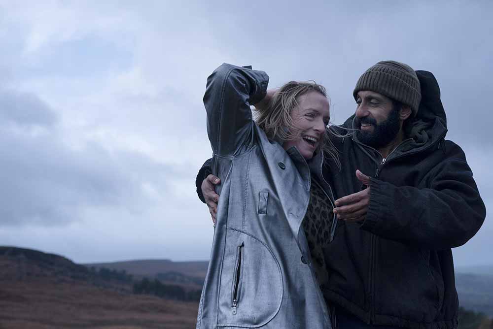 A man and a woman embrace outdoors in Ali & Ava, one of our most anticipated films of 2021.