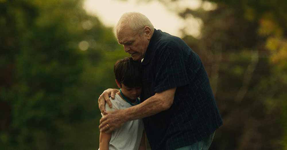 An elderly man embraces a young boy in Driveways, one of the best films of 2020.