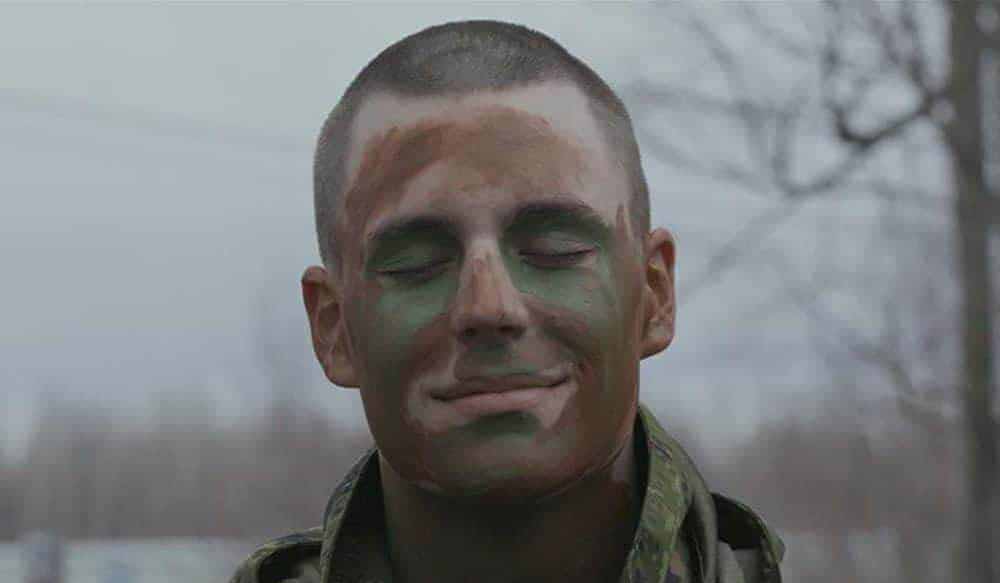 A closeup of a soldier's painted face in First Stripes, one of the best Canadian films of 2020.