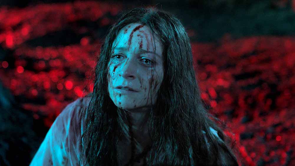 Niamh Algar, one of the most exciting emerging actors at Sundance 2021, is drenched in blood in this still from Censor.
