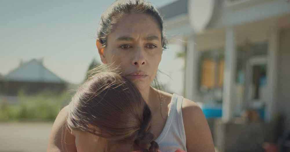 A distraught woman embraces her young daughter in Rustic Oracle, one of the best films of 2020.