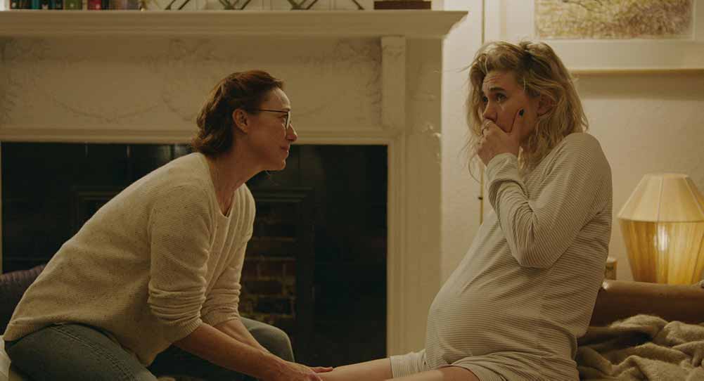 A two shot of Molly Parker and Vanessa Kirby, with Parker playing a midwife helping Kirby through a painful childbirth.