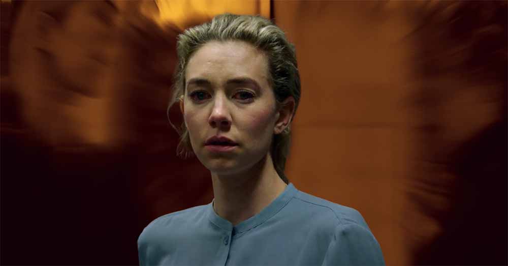 A still of Vanessa Kirby in Pieces of a Woman in front of a swirling orange background.