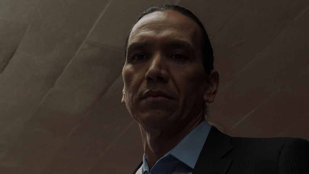 A closeup of Michael Greyeyes in Wild Indian, who gives one of the best performances of Sundance 2021.