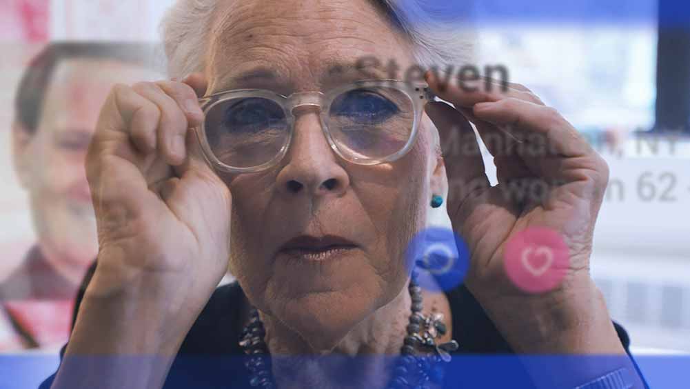 An older woman peers in the camera lens in Pacho Velez's Searchers.