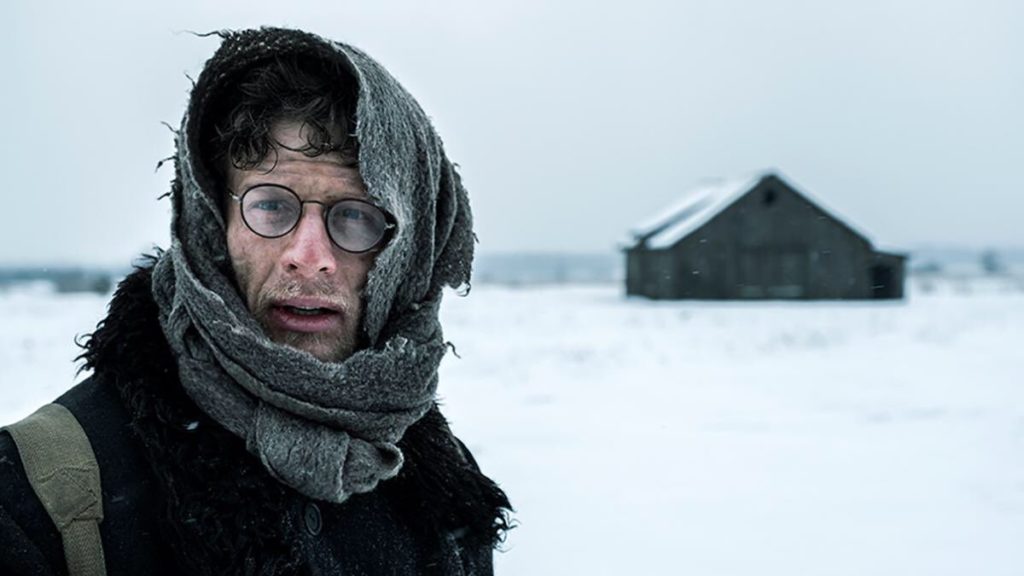 James Norton stars as Gareth  Jones in Agnieszka Holland's Mr. Jones. Here is walking through the snow in Ukraine, witnessing the famine. Courtesy of Samuel Goldwyn Pictures.