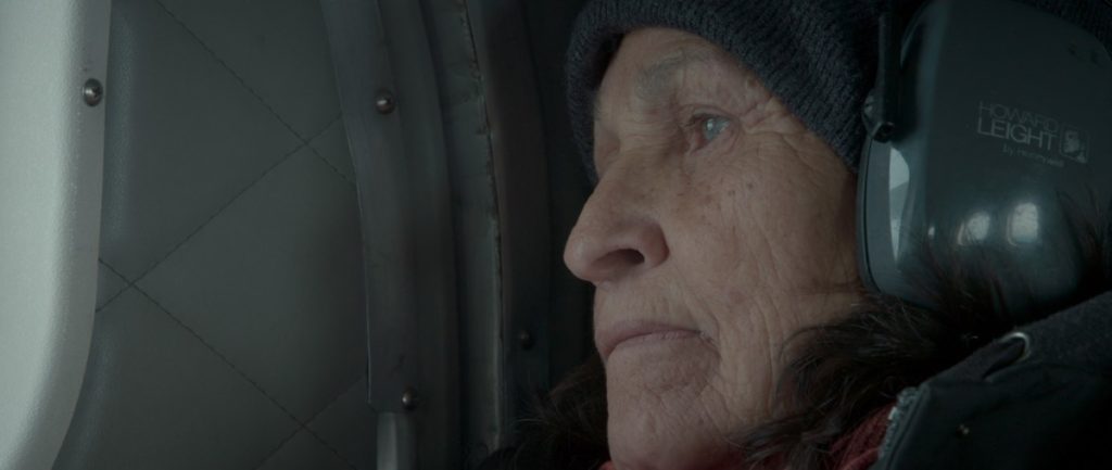 Joséphine Bacon looks down at Mushuau Nipi from a charter plane, and is full of emotion, in this moving scene from Call Me Human (Je m'appelle humain) directed by Kim O'Bomsawin