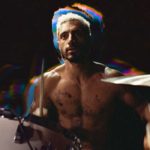 Riz Ahmed sits at a drum kit in Sound of Metal.