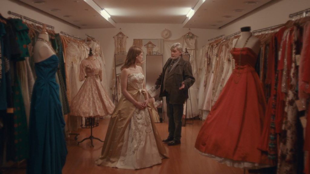 Jim (Nicholas Campbell) takes Darren (Kelly McCormack) shopping for gowns in Sugar Daddy.