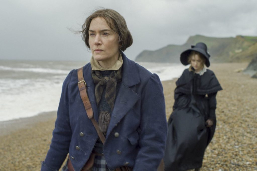 Mary's blazer and Charlotte's mourning costumes on the beach in Ammonite, designed by Michael O'Connor.