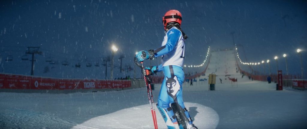 Noée Abita as Lyz in full ski gear at the bottom of the slope in Slalom, directed by Charlène Favier. Photo courtesy of Kino Lorber.