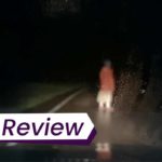 A still from DASHCAM, of a blurry figure in red, seem in the dark through a car's front window. The text on the images reads, 'TIFF Review'.