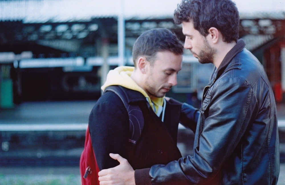 Glen and Russell at the train station at the end of Weekend. Just before this scene, they discuss having their Notting Hill moment, a film which director Andrew Haigh actually worked on. In this interview, writer-director Andrew Haigh discusses upending heteronormative narratives in Weekend.