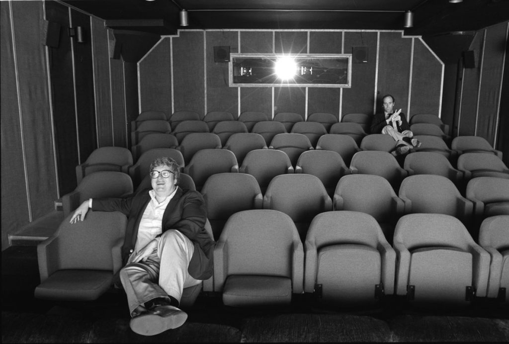 Gene Siskel and Roger Ebert in screening room for photo shoot for People Weekly, June 13, 1984; Chicago