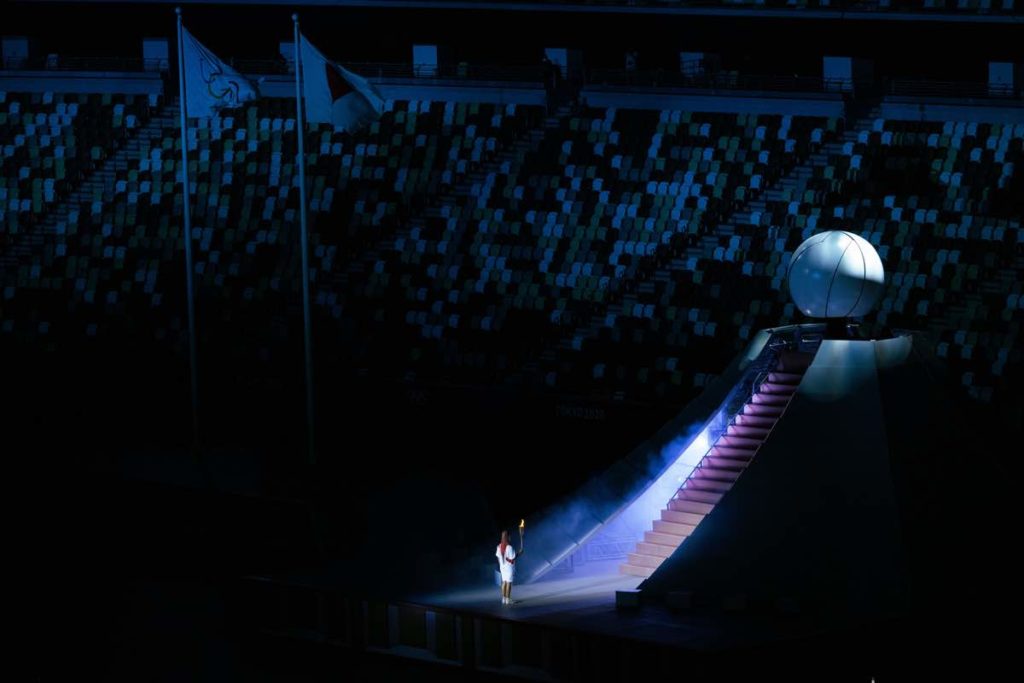 Still of the Olympic Torch being carried in Naomi Kawase's Official Film of the Olympic Games Tokyo 2020 Side A, which screened in Cannes Classics at Cannes 2022. ©2022-International Olympic Committee