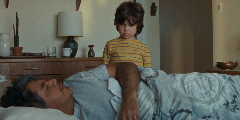Camilo gets awoken by his grandson around whom his world starts to revolve in Katherine Jerkovic's film Coyote. Photo courtesy of TIFF. Coyote is discussed in the context of fellow films at TIFF about Canadian immigration stories Riceboy Sleeps and So Much Tenderness.