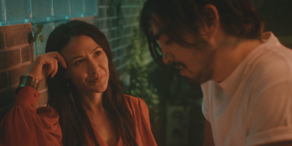 Elle-Máijá Tailfeathers and Braeden Clarke play two Indigenous people who meet and flirt at a bar in the middle of the apocalypse in Darlene Naponse's film Stellar, which Alex Heeney reviews out of TIFF. Photo courtesy of TIFF.