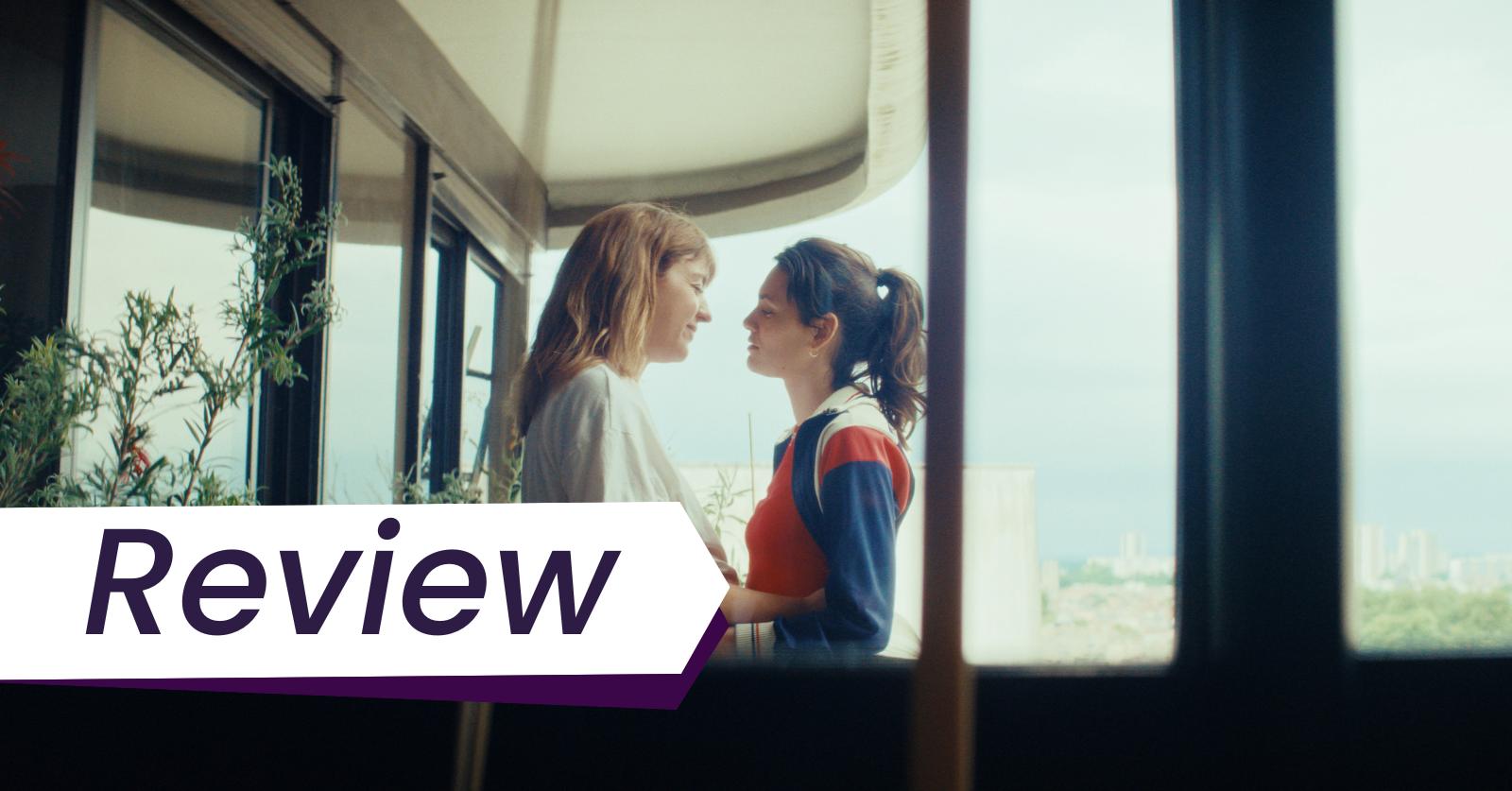 Monia Chokri (left) and Ella Rumpf (right) star in Alice Douard's feature debut Love Letters at the Cannes Film Festival in Critics' Week. Two white women embrace on the balcony of their apartment: one blond and pregnant, the other a brunette with a ponytail..